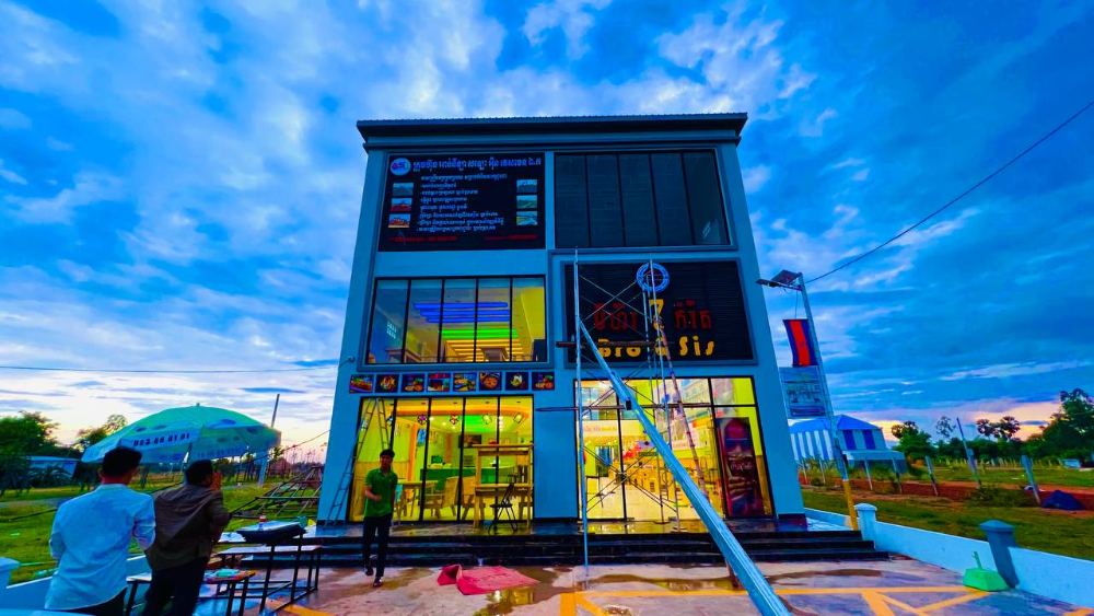 Three-storey Bro & Sis branch at dusk